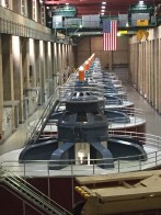The turbines and giant crane inside the generator room of the Hoover Dam.
